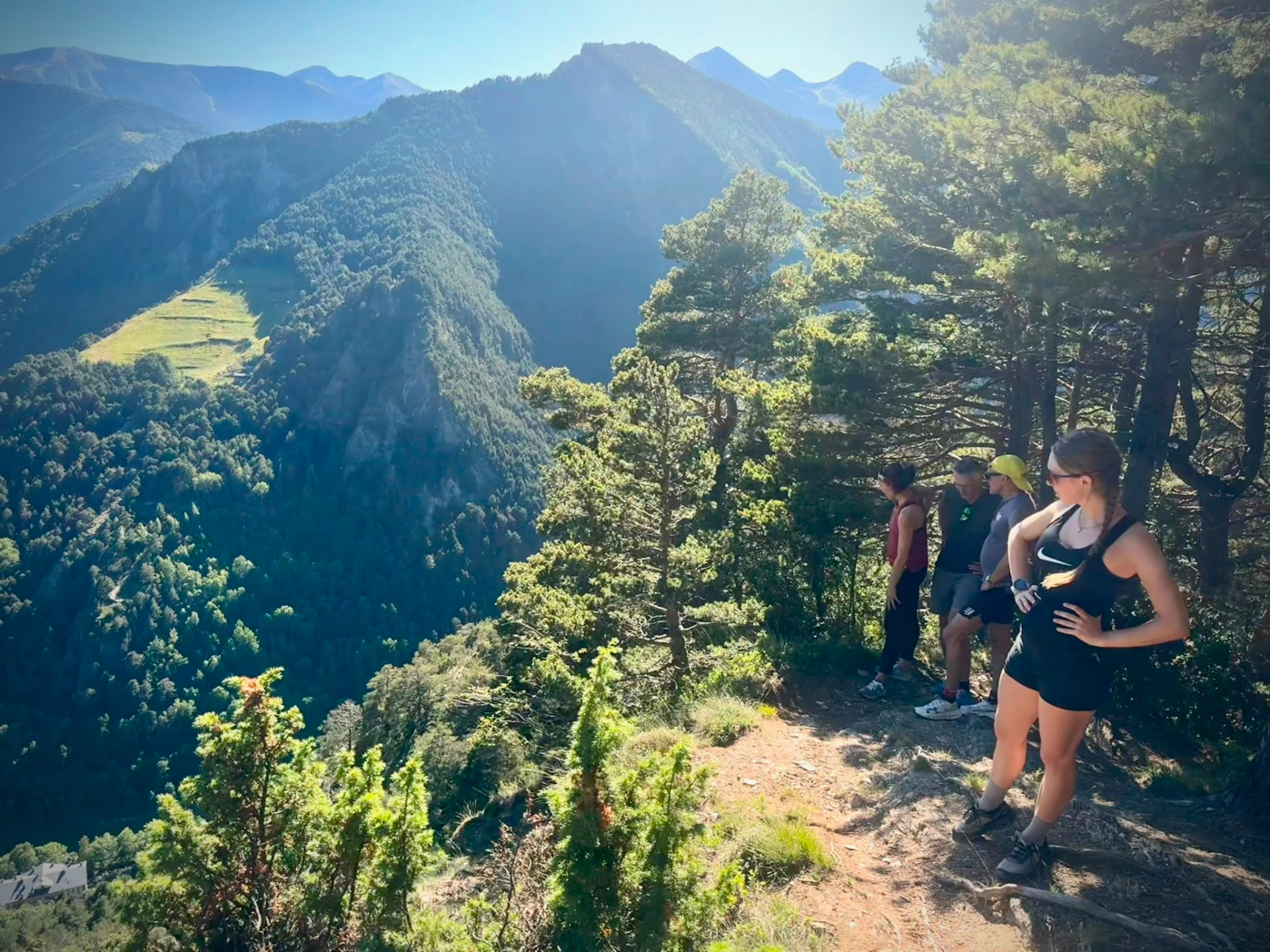 Run the Pyrenees runners at a pine-framed viewpoint above the Andorran valley