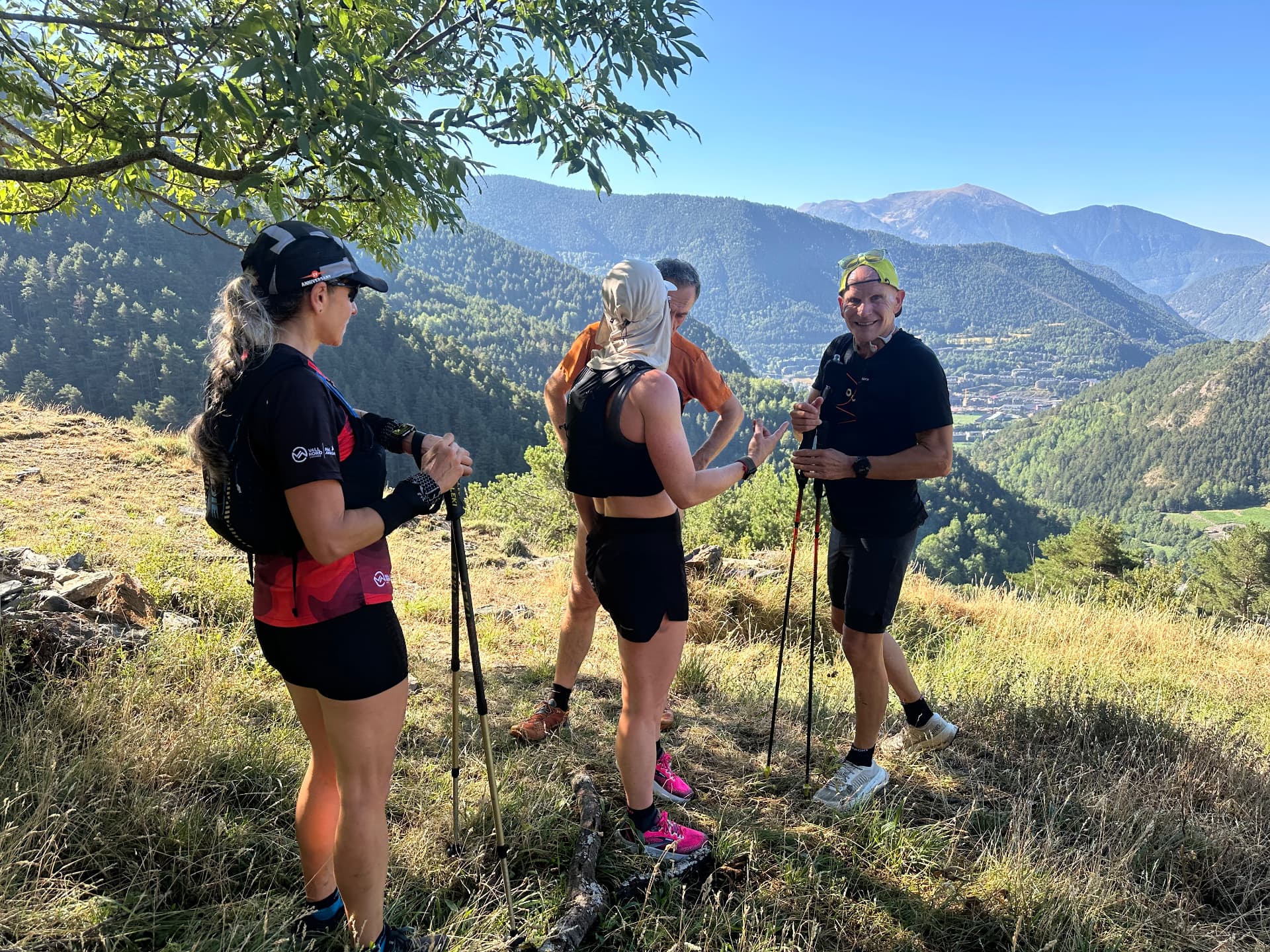 Runners at a viewpoint above Ordino, Andorra