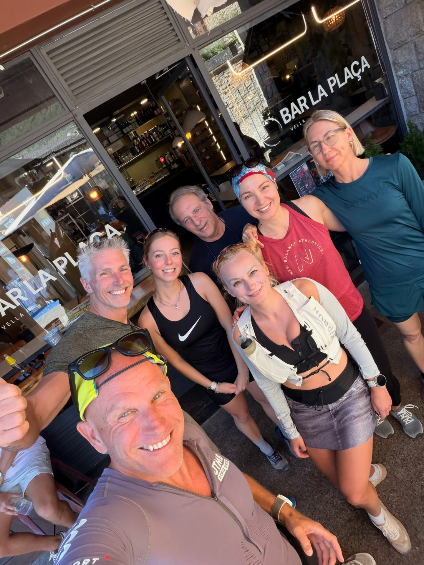 Run the Pyrenees group selfie outside Bar La Plaça in Ordino after a run