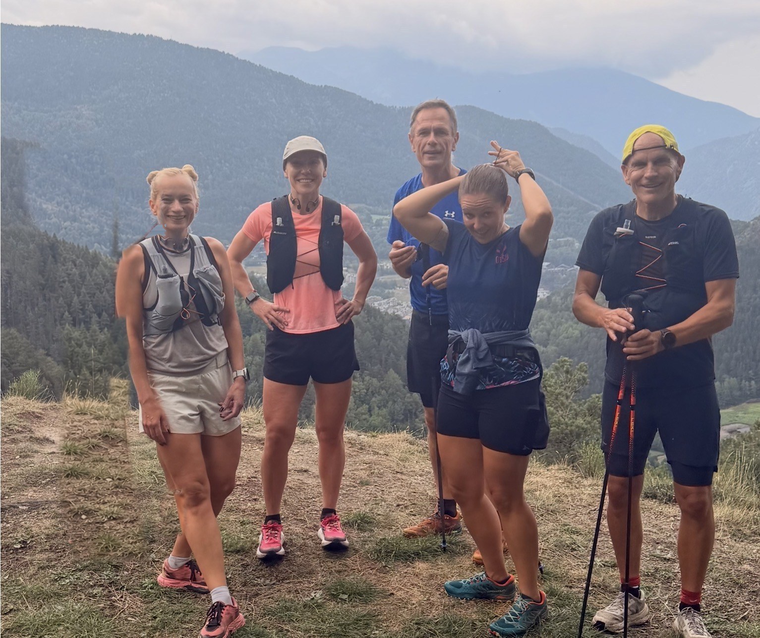 Run the Pyrenees group of trail runners gathered at a village race start in the Pyrenees