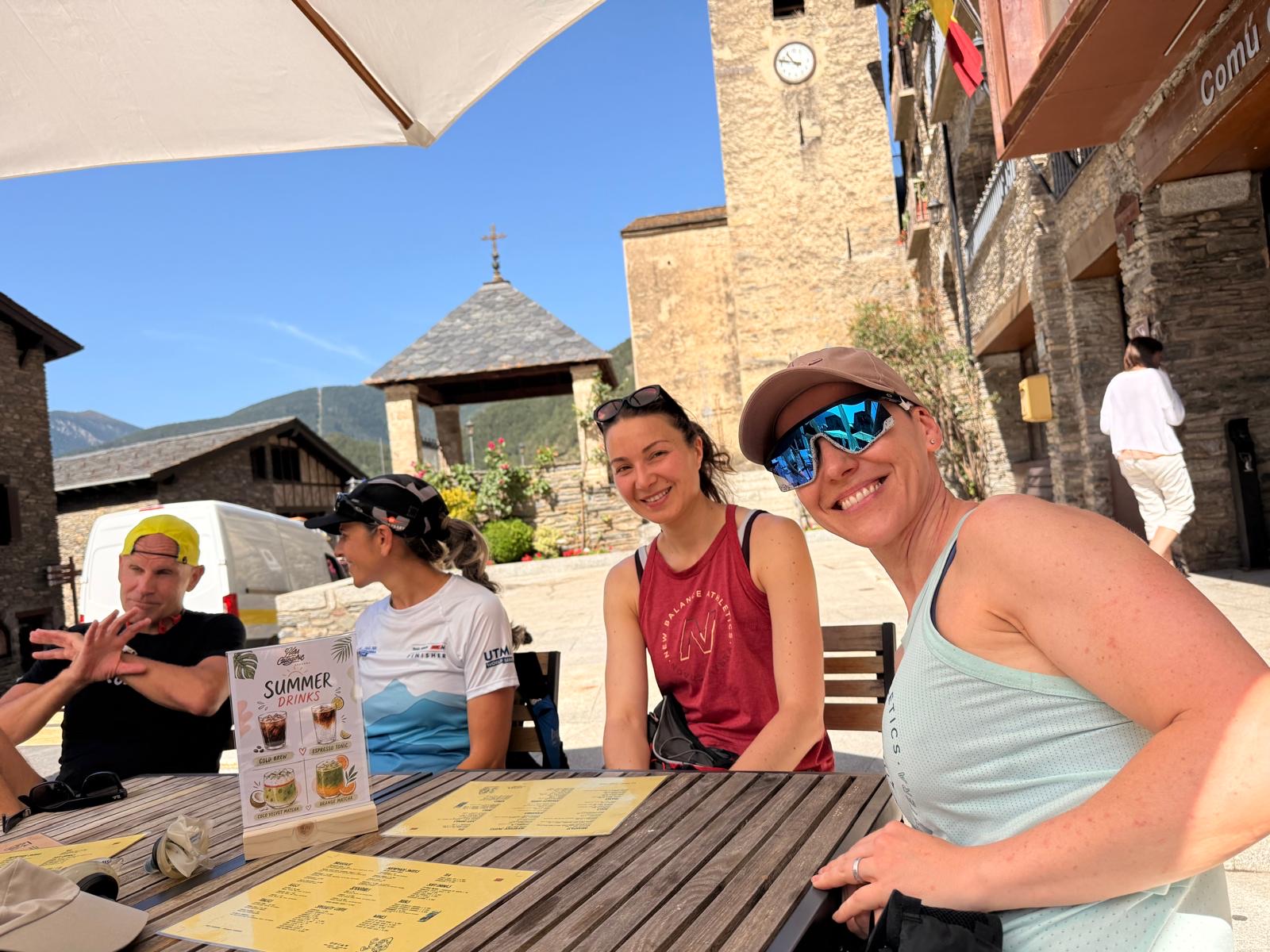 Run the Pyrenees runners together on a sunny café terrace in Ordino